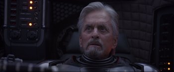 Movie still from “Ant-Man and the Wasp” (2018), directed by Peyton Reed – An older man with a gray beard looking up at the sky; Close Up shot, Low angle