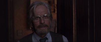 Movie still from “Ant-Man and the Wasp” (2018), directed by Peyton Reed – An older man with a beard and glasses; Close Up shot, Over the shoulder angle
