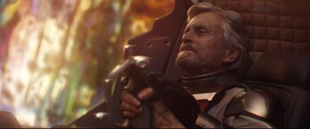 Movie still from “Ant-Man and the Wasp” (2018), directed by Peyton Reed – An older man holding a hammer in his hand; Close Up shot, Low angle