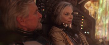 Movie still from “Ant-Man and the Wasp” (2018), directed by Peyton Reed – An older man and a woman sitting in an airplane cockpit; Medium shot, High angle