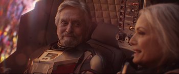 Movie still from “Ant-Man and the Wasp” (2018), directed by Peyton Reed – An older man sitting in a chair with headphones on; Close Up shot, Over the shoulder angle