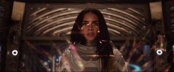 Movie still from “Ant-Man and the Wasp” (2018), directed by Peyton Reed – A woman with long black hair wearing a space suit; Close Up shot, Low angle