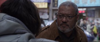 Movie still from “Ant-Man and the Wasp” (2018), directed by Peyton Reed – An older man wearing glasses and a brown jacket; Close Up shot, Over the shoulder angle