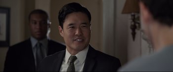 Movie still from “Ant-Man and the Wasp” (2018), directed by Peyton Reed – A person wearing a suit and tie; Close Up shot, Over the shoulder angle