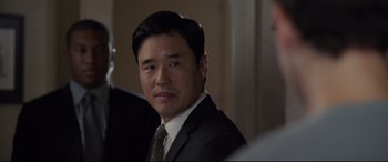 Movie still from “Ant-Man and the Wasp” (2018), directed by Peyton Reed – A person wearing a suit and tie; Close Up shot, Over the shoulder angle