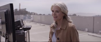 Movie still from “Ant-Man and the Wasp” (2018), directed by Peyton Reed – A woman with long white hair standing next to a parking meter; Close Up shot, Over the shoulder angle