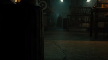 Movie still from “Snowfall” (2017), directed by Hiro Murai – A person standing in the dark in a room; Wide shot, Over the shoulder angle