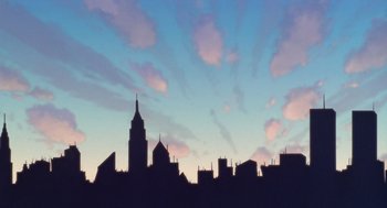 Movie still from “Antz” (1998), directed by Tim Johnson – A view of a city skyline at sunset; Extreme Wide shot, Low angle