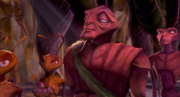 Movie still from “Antz” (1998), directed by Tim Johnson – A person wearing a red shirt and an orange tie; Close Up shot, High angle