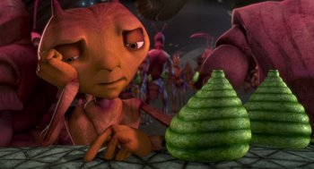 Movie still from “Antz” (1998), directed by Tim Johnson – An alien looking at a green spiral shaped object; Close Up shot, High angle