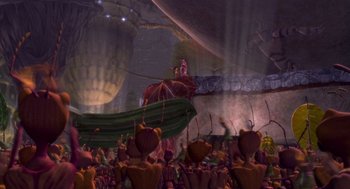Movie still from “Antz” (1998), directed by Tim Johnson – An image of an animated scene with a man on a horse in the background; Extreme Wide shot, High angle