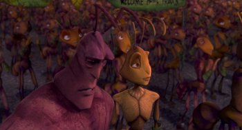 Movie still from “Antz” (1998), directed by Tim Johnson – A group of ants standing next to each other in a field; Medium shot, High angle