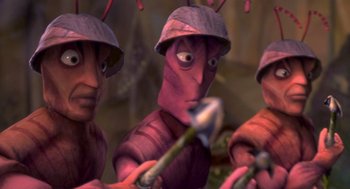 Movie still from “Antz” (1998), directed by Tim Johnson – A group of people with helmets on holding a plant; Extreme Close Up shot, High angle