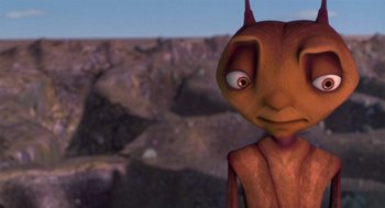 Movie still from “Antz” (1998), directed by Tim Johnson – An image of an animated character in a desert setting; Close Up shot, High angle
