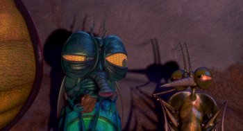 Movie still from “Antz” (1998), directed by Tim Johnson – A green bug's face with yellow eyes; Extreme Close Up shot, High angle