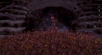 Movie still from “Antz” (1998), directed by Tim Johnson – An image of an ant in the middle of a field; Extreme Wide shot, High angle