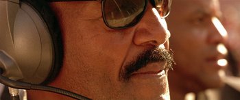 Movie still from “Any Given Sunday” (1999), directed by Oliver Stone – A man's face wearing sunglasses; Extreme Close Up shot, Low angle