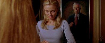 Movie still from “Any Given Sunday” (1999), directed by Oliver Stone – A woman is looking down at her face; Medium shot, Over the shoulder angle