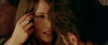 Movie still from “Any Given Sunday” (1999), directed by Oliver Stone – A woman's face and a man's face; Extreme Close Up shot, Over the shoulder angle
