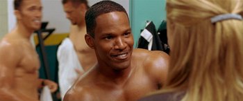 Movie still from “Any Given Sunday” (1999), directed by Oliver Stone – A shirtless man in a dressing room; Close Up shot, Over the shoulder angle