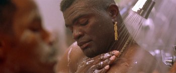 Movie still from “Any Given Sunday” (1999), directed by Oliver Stone – A person taking a shower; Close Up shot, Low angle