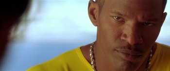Movie still from “Any Given Sunday” (1999), directed by Oliver Stone – A person wearing a yellow shirt; Close Up shot, Low angle