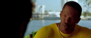 Movie still from “Any Given Sunday” (1999), directed by Oliver Stone – A person wearing a yellow shirt; Close Up shot, Over the shoulder angle