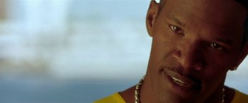 Movie still from “Any Given Sunday” (1999), directed by Oliver Stone – A person wearing a yellow shirt; Close Up shot, Low angle