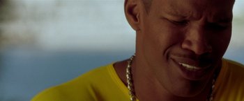 Movie still from “Any Given Sunday” (1999), directed by Oliver Stone – A person wearing a yellow shirt; Extreme Close Up shot, High angle