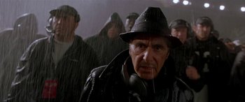 Movie still from “Any Given Sunday” (1999), directed by Oliver Stone – An older man wearing a hat and a leather jacket; Close Up shot, Low angle