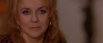 Movie still from “Any Given Sunday” (1999), directed by Oliver Stone – A woman's face with long blonde hair; Close Up shot, Over the shoulder angle