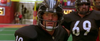 Movie still from “Any Given Sunday” (1999), directed by Oliver Stone – A football player wearing a helmet; Close Up shot, High angle