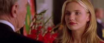 Movie still from “Any Given Sunday” (1999), directed by Oliver Stone – A person with long blonde hair; Close Up shot, Over the shoulder angle