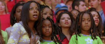 Movie still from “Any Given Sunday” (1999), directed by Oliver Stone – A group of people that are standing in a crowd; Close Up shot, Low angle