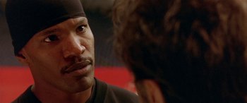 Movie still from “Any Given Sunday” (1999), directed by Oliver Stone – A person with a beard; Close Up shot, Over the shoulder angle