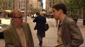 Movie still from “Anything Else” (2003), directed by Woody Allen – Two men are standing on the sidewalk of a city street; Medium shot, Over the shoulder angle
