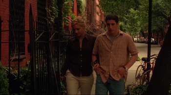 Movie still from “Anything Else” (2003), directed by Woody Allen – A man and a woman walking down a sidewalk; Medium shot, High angle