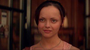 Movie still from “Anything Else” (2003), directed by Woody Allen – A person wearing a necklace; Close Up shot, High angle