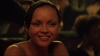 Movie still from “Anything Else” (2003), directed by Woody Allen – A person smiling for the camera; Close Up shot, Over the shoulder angle