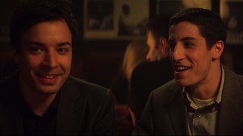 Movie still from “Anything Else” (2003), directed by Woody Allen – Two men in suits are sitting at a table; Close Up shot, Over the shoulder angle