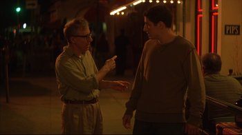 Movie still from “Anything Else” (2003), directed by Woody Allen – Two men are talking in the street at night; Medium shot, Over the shoulder angle