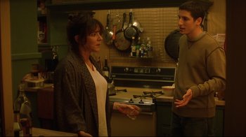 Movie still from “Anything Else” (2003), directed by Woody Allen – A woman and a man standing in a kitchen talking; Medium shot, Over the shoulder angle