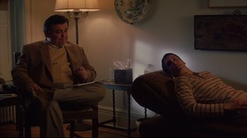 Movie still from “Anything Else” (2003), directed by Woody Allen – A man and a woman sitting in a living room next to each other; Medium shot, Over the shoulder angle