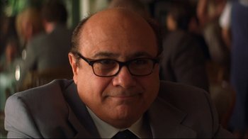 Movie still from “Anything Else” (2003), directed by Woody Allen – A person wearing a suit and glasses; Close Up shot, Over the shoulder angle