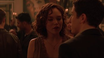 Movie still from “Anything Else” (2003), directed by Woody Allen – A woman is talking to a man at a party; Close Up shot, Over the shoulder angle