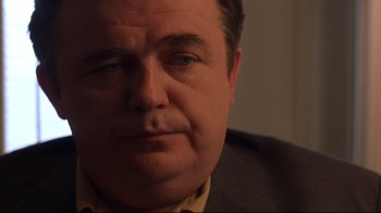 Movie still from “Anything Else” (2003), directed by Woody Allen – A man's face in the dark; Close Up shot, Over the shoulder angle