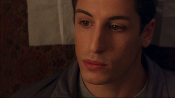 Movie still from “Anything Else” (2003), directed by Woody Allen – A man's face in a dark room; Close Up shot, High angle
