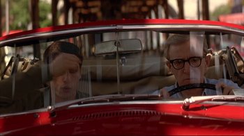 Movie still from “Anything Else” (2003), directed by Woody Allen – Two men are sitting in a red vintage car; Close Up shot, Low angle