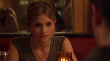 Movie still from “Anything Else” (2003), directed by Woody Allen – A beautiful young lady sitting at a table; Close Up shot, Over the shoulder angle
