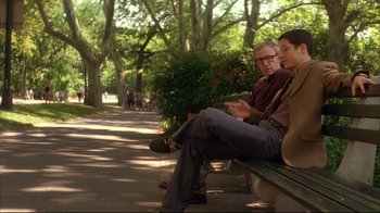 Movie still from “Anything Else” (2003), directed by Woody Allen – A man and a woman sitting on a park bench; Wide shot, Over the shoulder angle